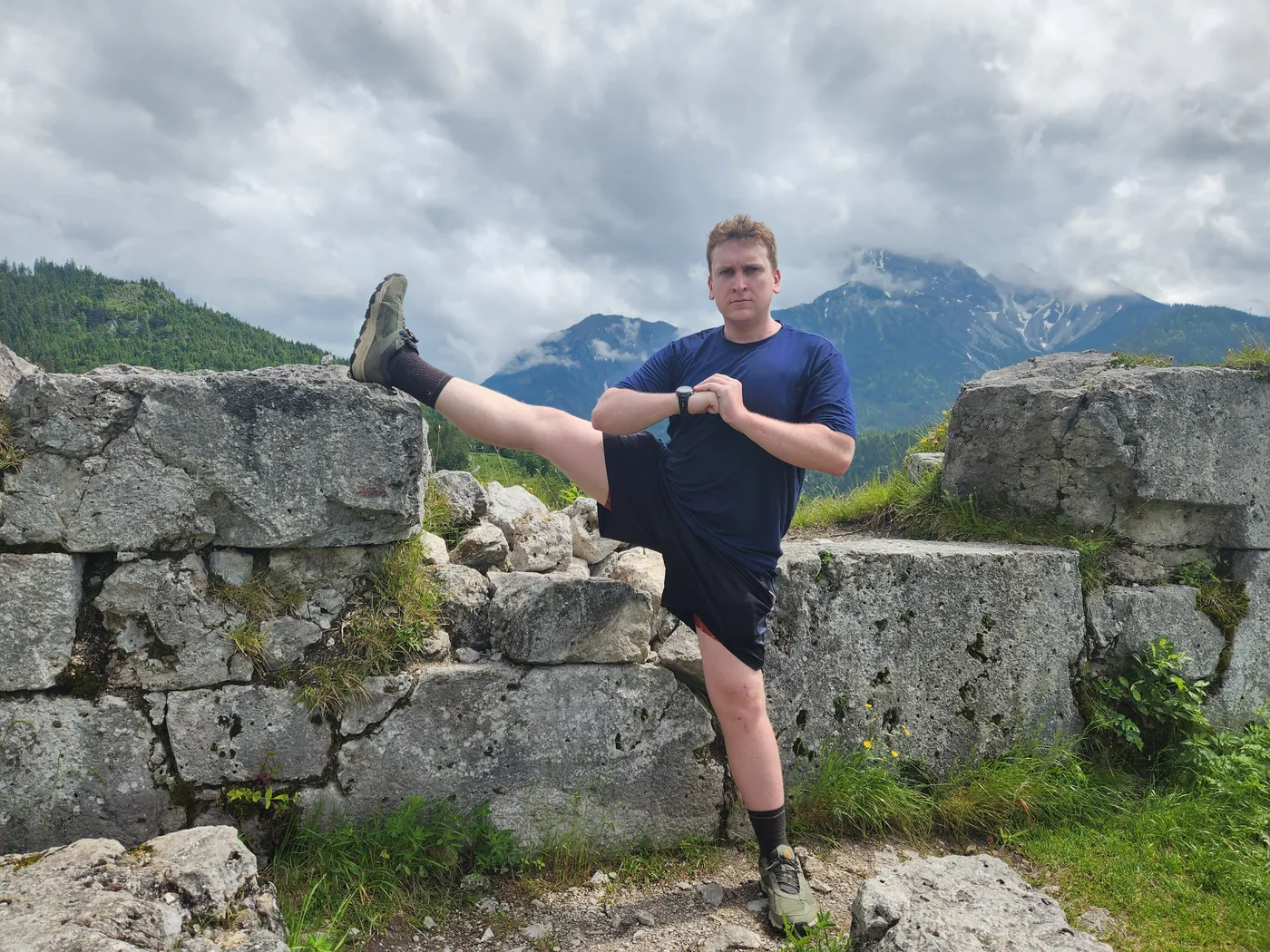 Goofing around on a stone wall in the Alps