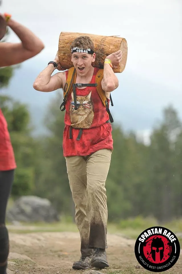 Hauling a log up a hill during a Spartan Race
